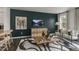 Living area with dark green accent wall and comfortable seating at 752 Dorset Stream Dr, Fuquay Varina, NC 27526