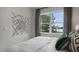 Bedroom featuring a bed, window with a view, and modern wall art at 756 Dorset Stream Dr, Fuquay Varina, NC 27526
