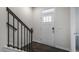 Inviting entryway with hardwood floors, staircase, and a white door at 756 Dorset Stream Dr, Fuquay Varina, NC 27526