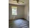 Simple bedroom with wood-look floors and a window at 1222 Hargrove St, Rocky Mount, NC 27801