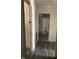 Long hallway with wood-look floors and doors to other rooms at 1222 Hargrove St, Rocky Mount, NC 27801