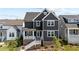 Two-story craftsman home with gray siding and blue door at 36 Whitehall Dr, Pittsboro, NC 27312