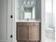 Modern bathroom with brown vanity and a toilet at 1245 Azalea Garden Circle, Raleigh, NC 27603