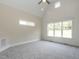 Bright bedroom with vaulted ceiling, carpeting, and large windows at 1245 Azalea Garden Circle, Raleigh, NC 27603