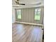 Main bedroom with wood-look flooring and wainscoting at 0 Will Suitt Rd, Butner, NC 27522