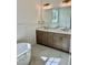 Elegant bathroom with double vanity, soaking tub, and marble tile at 0 Will Suitt Rd, Butner, NC 27522