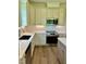 Modern kitchen with stainless steel appliances and white cabinets at 0 Will Suitt Rd, Butner, NC 27522