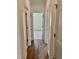 Bright hallway with light wood flooring connecting bedrooms and bathrooms at 0 Will Suitt Rd, Butner, NC 27522