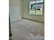 Bright bedroom with neutral carpeting and a view of the neighborhood at 0 Will Suitt Rd, Butner, NC 27522