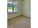 Well-lit bedroom with neutral carpeting and large window at 0 Will Suitt Rd, Butner, NC 27522