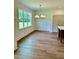 Bright dining room with hardwood floors and large windows at 0 Will Suitt Rd, Butner, NC 27522