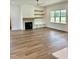 Spacious living room featuring a fireplace and built-in shelving at 0 Will Suitt Rd, Butner, NC 27522