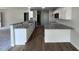 Modern kitchen with granite countertops and stainless steel appliances at 32 Oakfield Trace Dr, Four Oaks, NC 27524