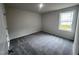 Bright bedroom with neutral walls and carpet flooring at 32 Oakfield Trace Dr, Four Oaks, NC 27524