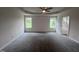 Large main bedroom with plush carpet and ceiling fan at 32 Oakfield Trace Dr, Four Oaks, NC 27524