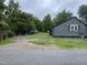 Gray house exterior with a side yard and driveway at 321 Blalock St, Holly Springs, NC 27540