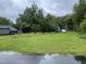Vacant lot with some overgrown weeds at 321 Blalock St, Holly Springs, NC 27540