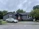 Gray house with a car parked in the driveway at 321 Blalock St, Holly Springs, NC 27540