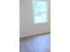 Bright bedroom with hardwood floors and a window overlooking trees at 1318 Timothy Avenue Ave, Durham, NC 27707