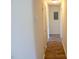 Clean hallway with light walls and wood-look flooring at 1318 Timothy Avenue Ave, Durham, NC 27707