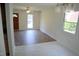 Bright dining area with wood-look floors and large windows at 1318 Timothy Avenue Ave, Durham, NC 27707