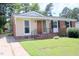 Brick ranch house with a newly painted exterior at 1318 Timothy Avenue Ave, Durham, NC 27707