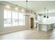 Dining room with hardwood floors, a large window, and a chandelier at 1140 Cottonsprings Dr, Wendell, NC 27591