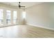 Bedroom with hardwood floors and access to a private balcony at 1140 Cottonsprings Dr, Wendell, NC 27591