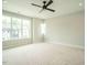 Spacious bedroom with large windows and ceiling fan at 1140 Cottonsprings Dr, Wendell, NC 27591