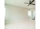 Bright bedroom featuring large windows, carpet and ceiling fan at 1140 Cottonsprings Dr, Wendell, NC 27591