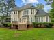 Two-story house with beige siding, deck, and landscaped yard at 441 Mountain Laurel, Chapel Hill, NC 27517