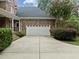 White garage door and brick exterior at 441 Mountain Laurel, Chapel Hill, NC 27517