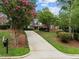 Long driveway leading to a two-story brick home at 441 Mountain Laurel, Chapel Hill, NC 27517