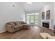 Spacious living room with fireplace and access to deck at 1635 Shepherds Glade Dr, Apex, NC 27523