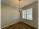 Bright dining room with hardwood floors and a chandelier at 280 Springtooth Dr, Zebulon, NC 27597