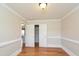 Well-lit bedroom with hardwood floors and double closets at 216 Stoney Dr, Durham, NC 27703