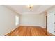Spacious bedroom with hardwood floors and a window at 216 Stoney Dr, Durham, NC 27703