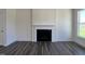 Living room featuring a fireplace and dark gray wood-look flooring at 573 Highview Drive Dr, Benson, NC 27504