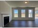 Living room with a fireplace and large windows overlooking the backyard at 573 Highview Drive Dr, Benson, NC 27504