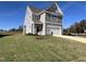 Two-story house with gray siding, a two-car garage and landscaped lawn at 573 Highview Drive Dr, Benson, NC 27504