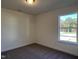 Spacious bedroom with carpet flooring and a large window at 573 Highview Drive Dr, Benson, NC 27504