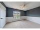 Spacious bedroom with neutral walls and carpet flooring at 128 Dove Cottage Ln, Cary, NC 27519