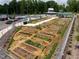 Community garden with numerous raised garden beds at 128 Dove Cottage Ln, Cary, NC 27519