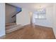 Bright dining area with hardwood floors and staircase at 128 Dove Cottage Ln, Cary, NC 27519