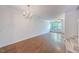 Spacious dining room with hardwood floors and chandelier at 128 Dove Cottage Ln, Cary, NC 27519