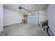 Spacious garage with overhead storage and automatic door opener at 128 Dove Cottage Ln, Cary, NC 27519