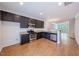 Open concept kitchen with stainless steel appliances at 128 Dove Cottage Ln, Cary, NC 27519