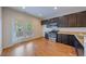 Modern kitchen with stainless steel appliances and hardwood floors at 128 Dove Cottage Ln, Cary, NC 27519