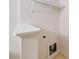 Laundry area with shelving and hookups for washer and dryer at 128 Dove Cottage Ln, Cary, NC 27519