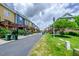 Row of townhomes with individual decks and parking at 128 Dove Cottage Ln, Cary, NC 27519